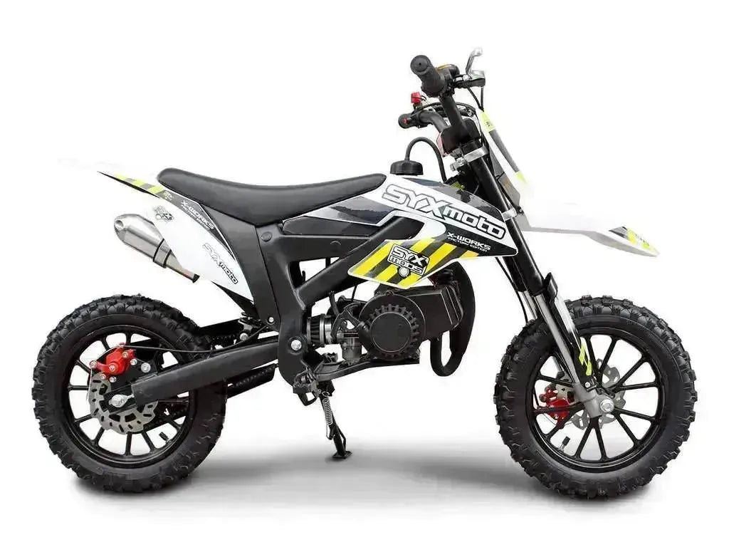 Kids small dirt bike with off-road tires and SYXmoto graphics, side profile view