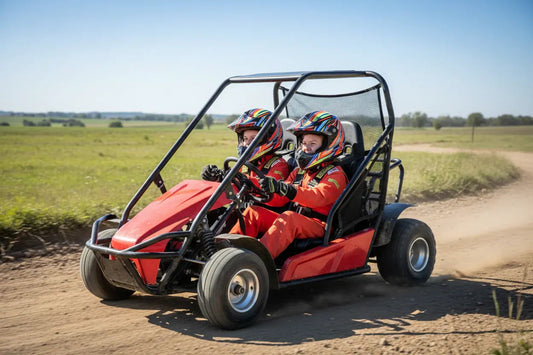 Two kids driving a red go-kart with roll cage on a dirt track in open field