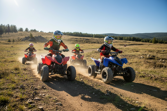 Kids riding youth ATVs on a dirt trail outdoors, wearing helmets and safety gear.