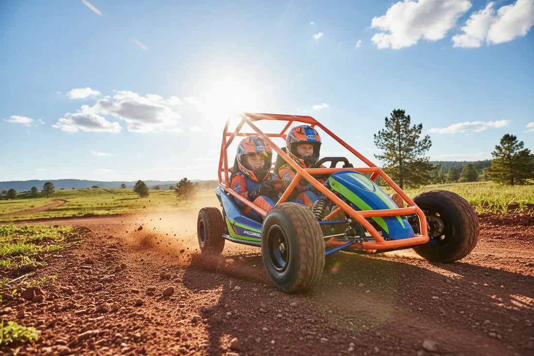 Kids riding off-road go-kart with roll cage on a dirt trail in outdoor countryside.