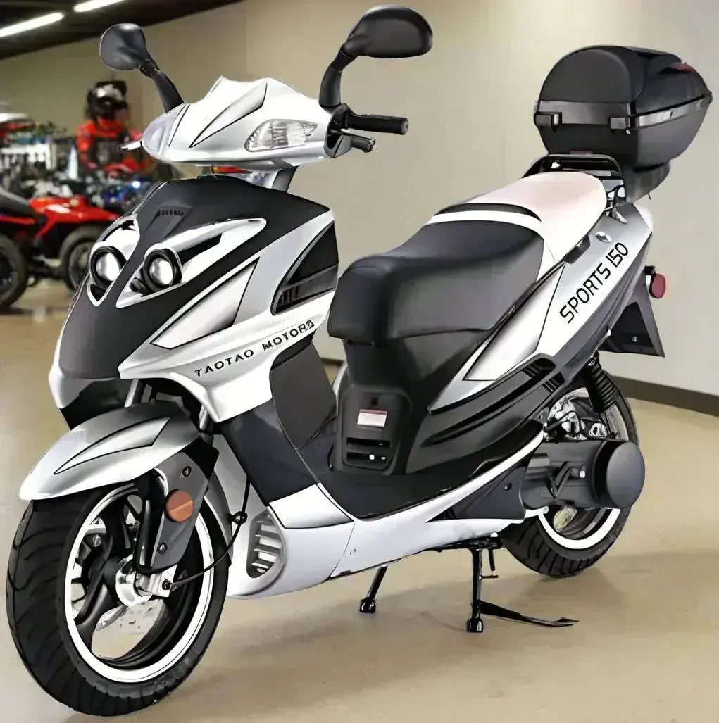 White and black TaoTao Sports 150cc scooter with storage box, displayed indoors
