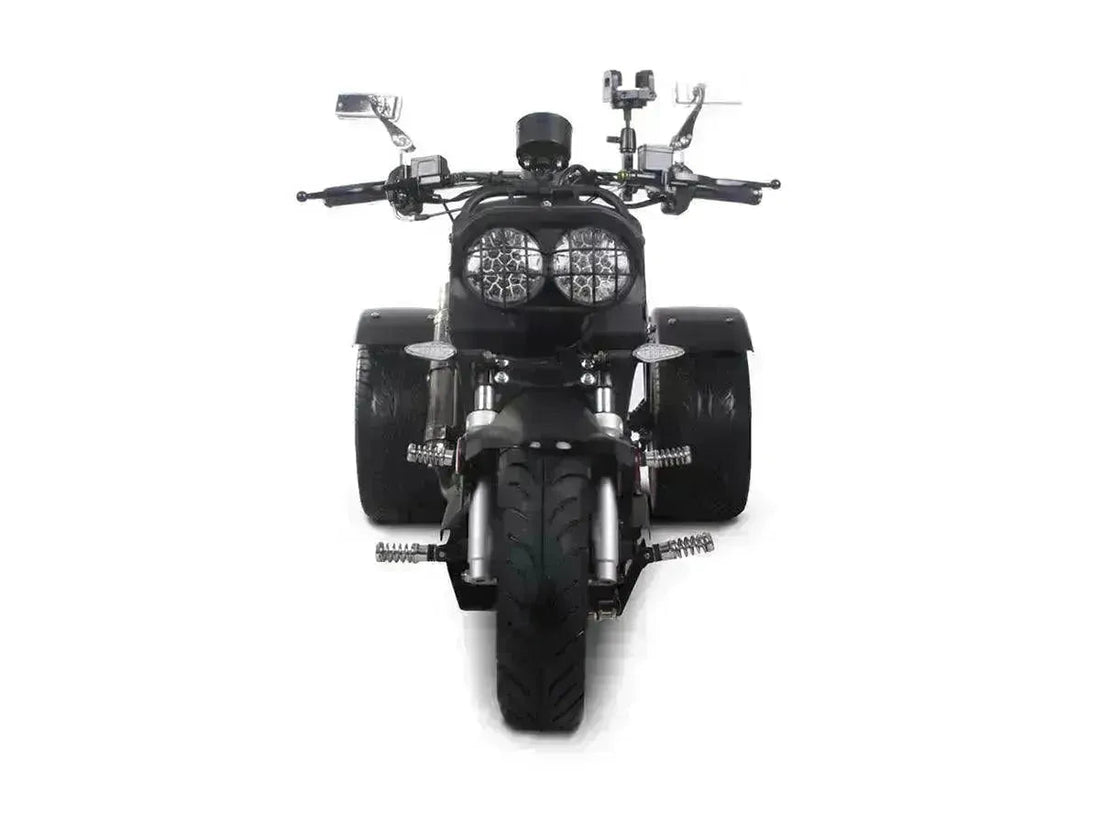 Front view of a black 50cc trike scooter with wide tires and dual headlights on white background