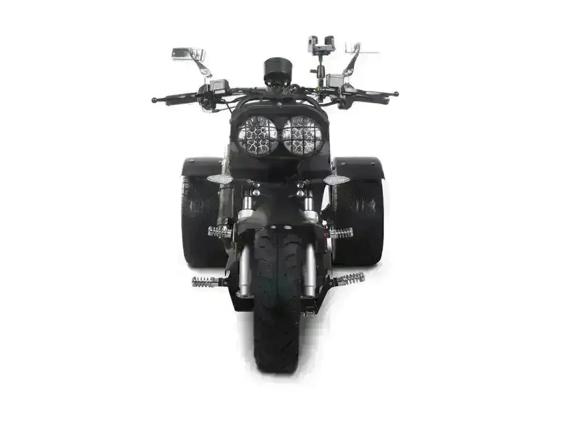 Front view of a black 50cc trike scooter with wide rear tires and dual round headlights