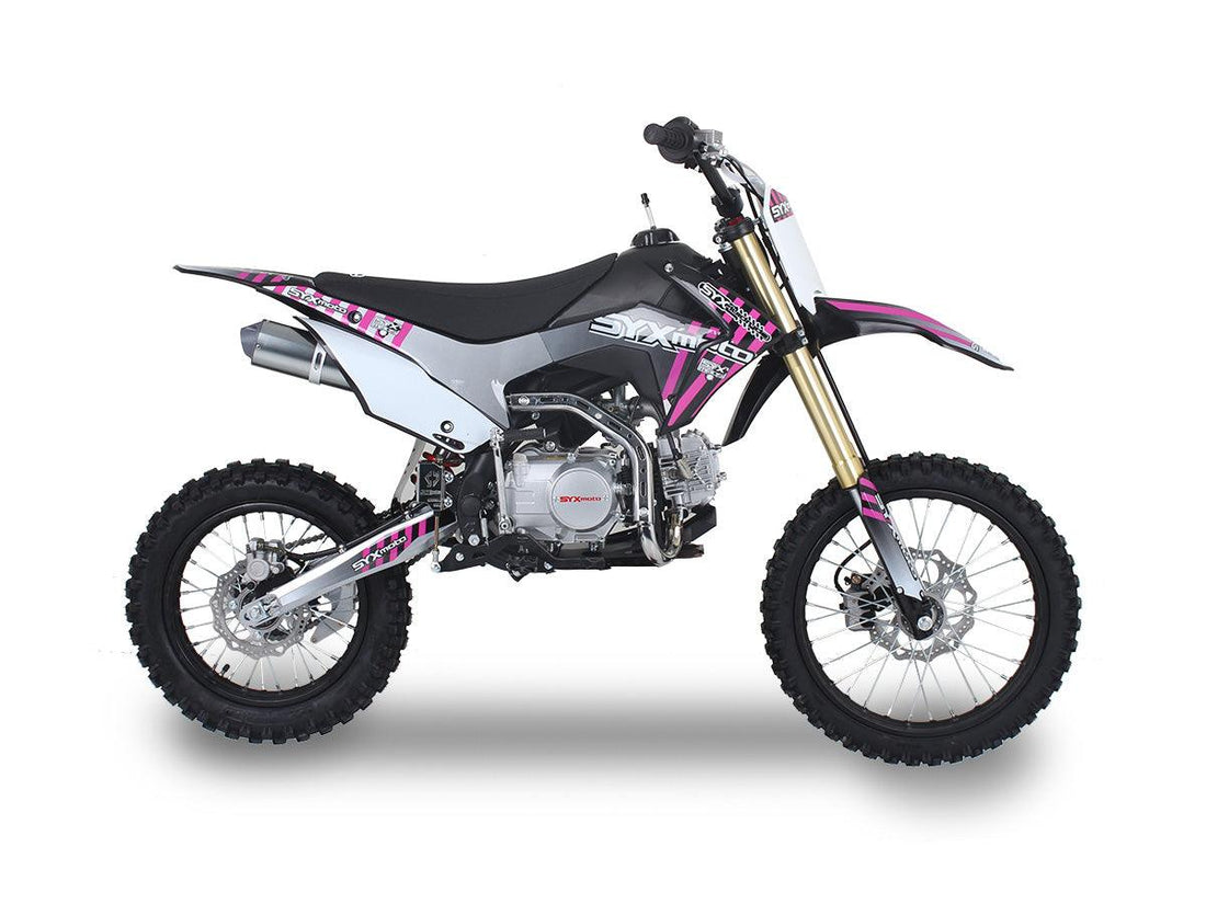 Pink and black 125cc dirt bike with off-road tires and visible engine on white background
