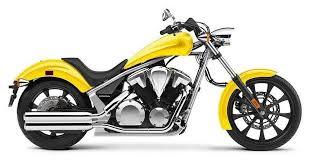 Yellow cruiser motorcycle with chrome accents and black wheels, side view on white background