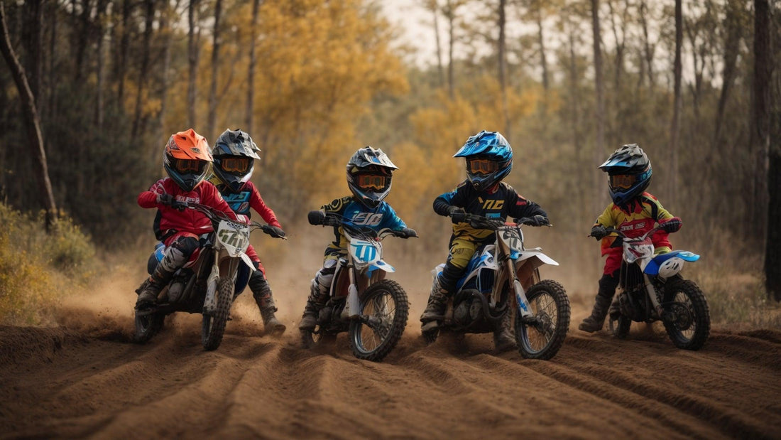 Group of kids riding gas-powered youth dirt bikes on a forest trail, wearing helmets and gear.