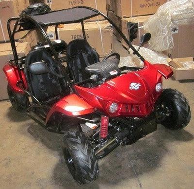 Red youth gas-powered go-kart with off-road tires and roll cage in warehouse setting at Q9 PowerSports USA