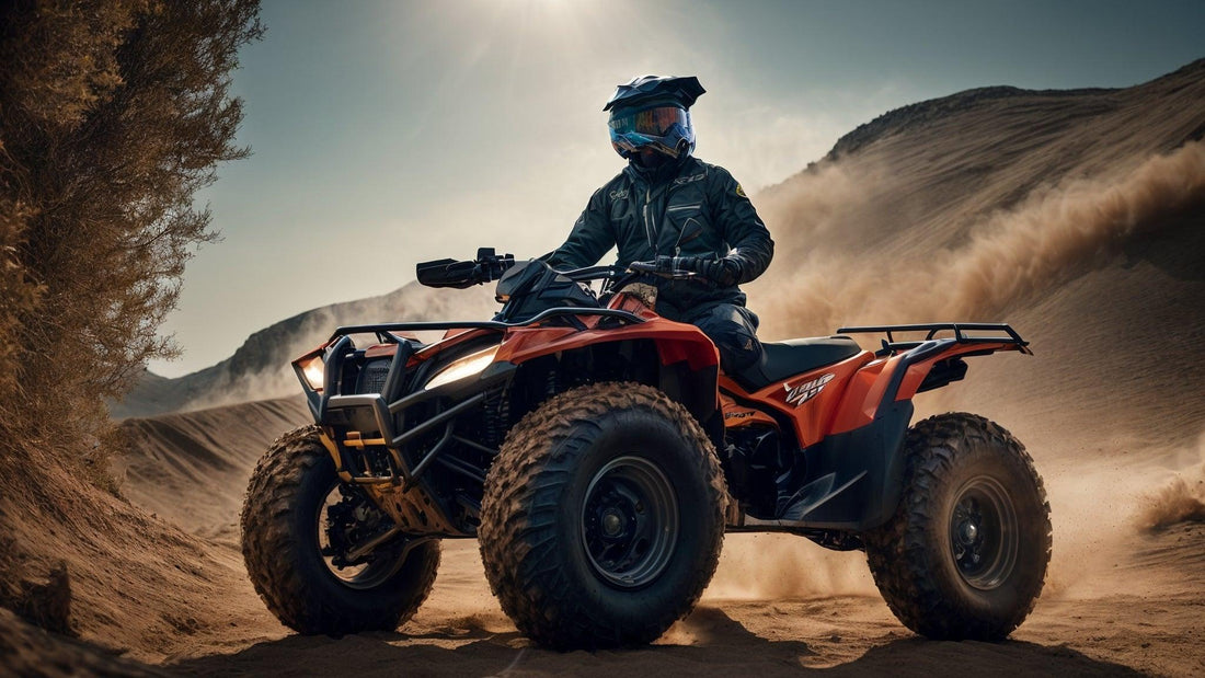 Rider on an orange Q9 PowerSports ATV driving off-road in sandy desert terrain