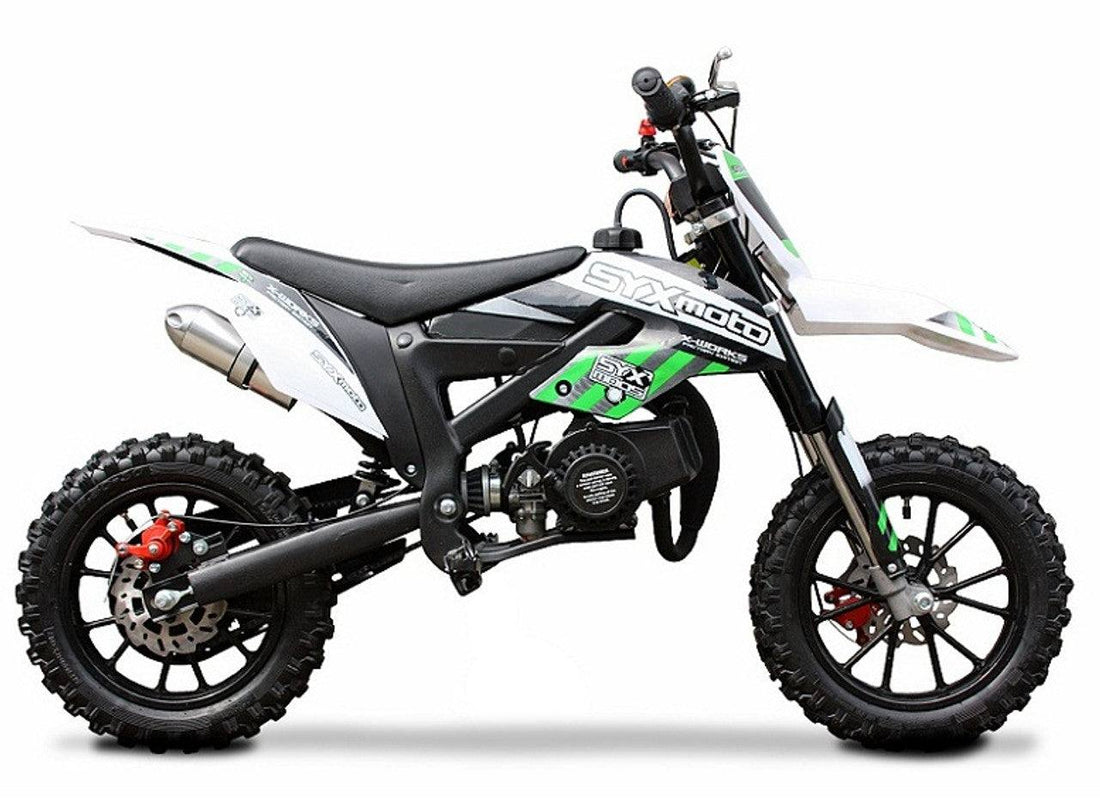 Compact kids pit bike with green and white graphics, rugged tires, and SYXmoto branding