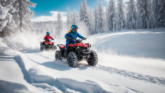 Two people riding red ATVs through snowy forest trails in winter, with snow-covered trees.