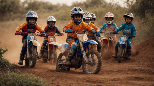 Group of kids riding beginner dirt bikes on a dirt trail, wearing helmets and racing gear