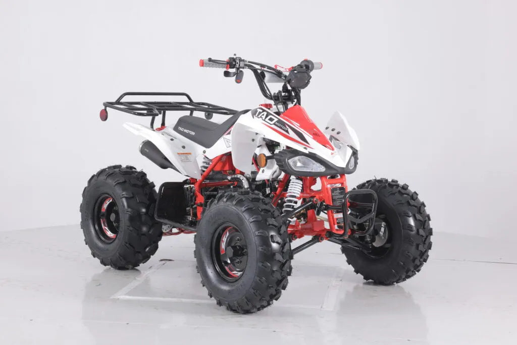 Red and white all-terrain vehicle with rugged tires, front brush guard, and rear cargo rack