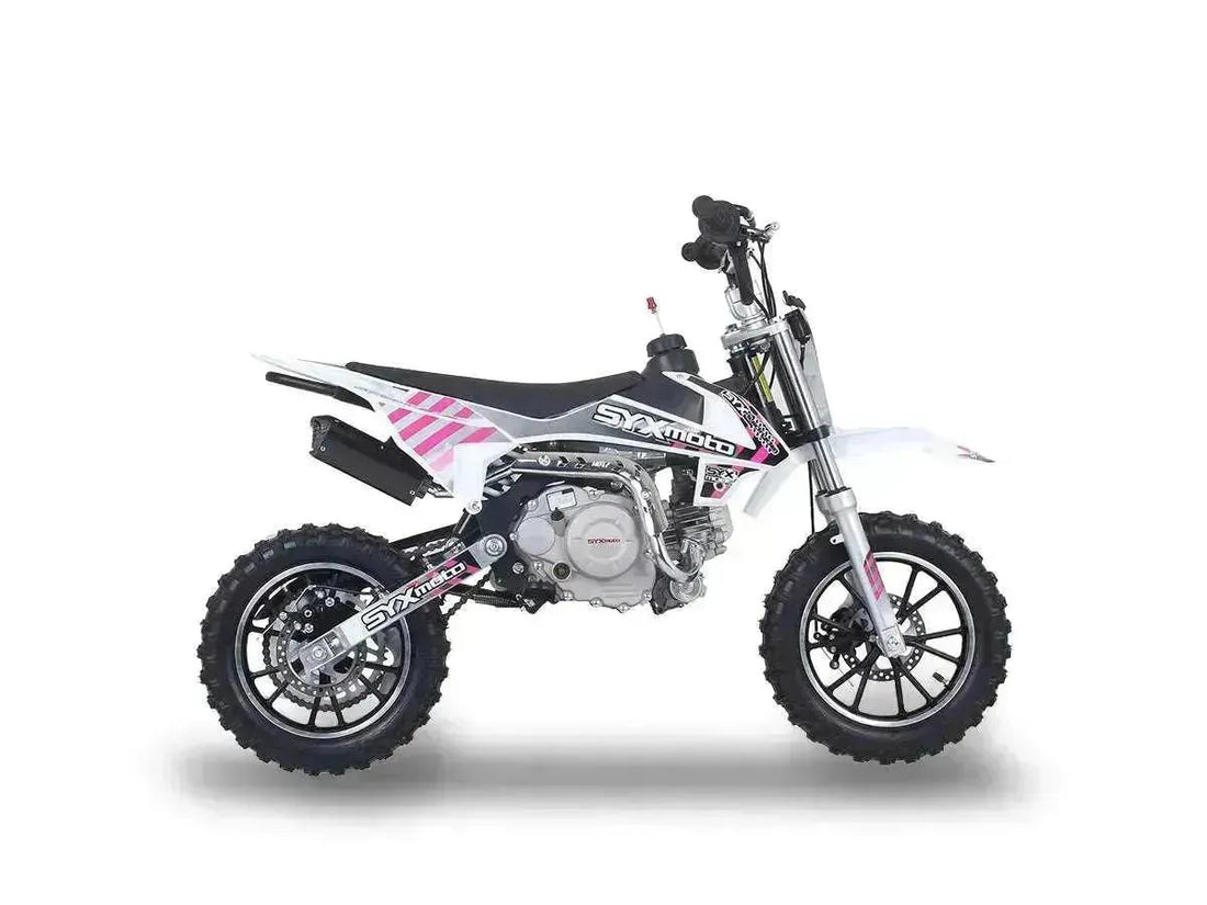 Kids 60cc pit bike with off-road tires, white and pink graphics, side view