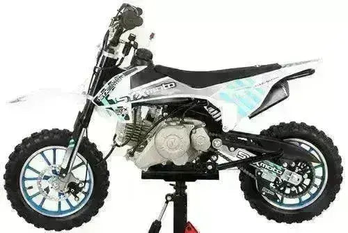 Kids 60cc pit bike with knobby tires, black frame, and graphic decals on a stand