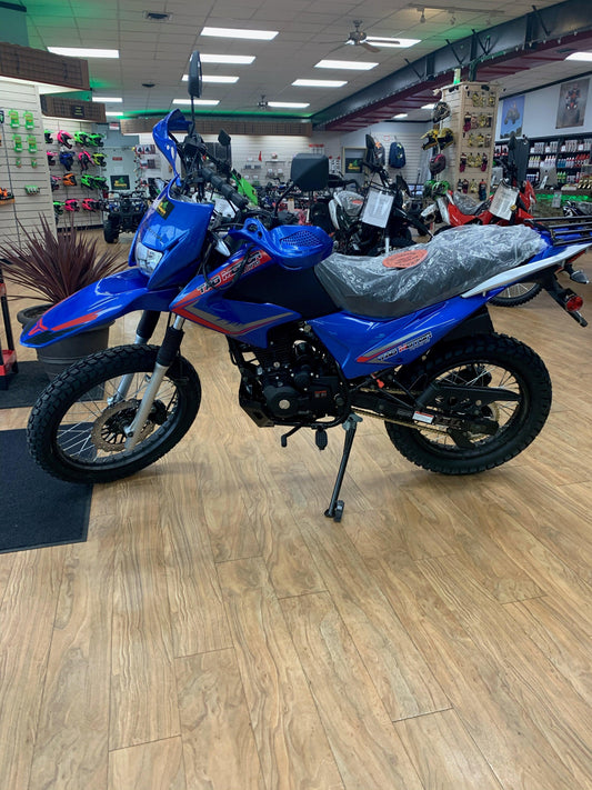 Blue 250cc dual sport motorcycle on showroom floor, off-road tires, and upright handlebars