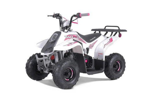 White and pink youth ATV with rugged tires and rear rack on a white background
