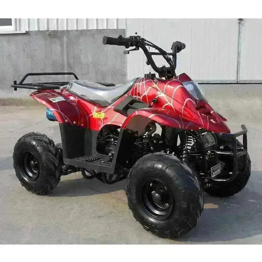 Red kids 4 wheeler ATV with spider web graphic, outdoor concrete background