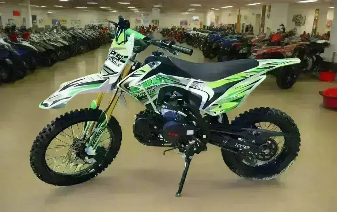 Green and white RPS 125 DLX dirt bike with knobby tires displayed in a showroom