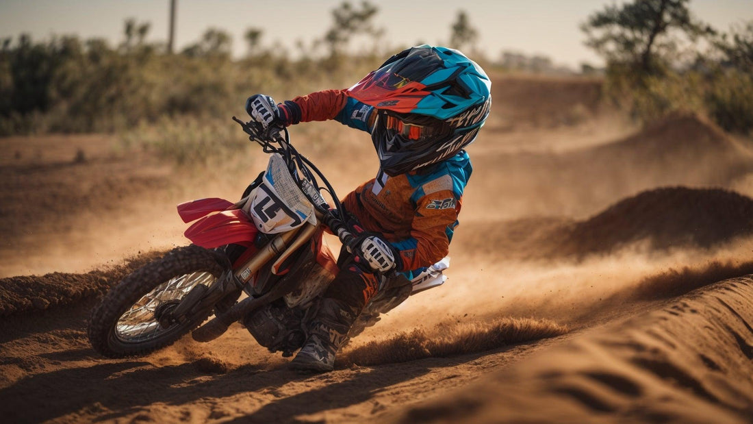 Kid riding small gas-powered dirt bike on an outdoor dirt track, wearing helmet and gear