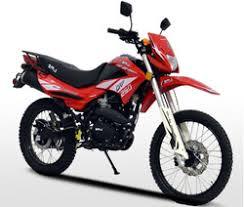 Red 250cc dual sport motorcycle for beginners, side view on white background