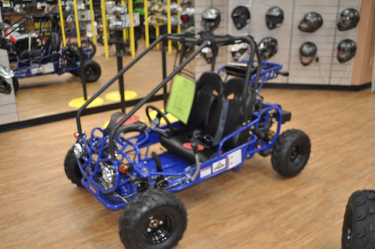Blue youth gas-powered go-kart with roll cage and off-road tires in showroom