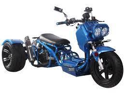 Blue 50cc trike scooter with dual headlights and sporty design on white background