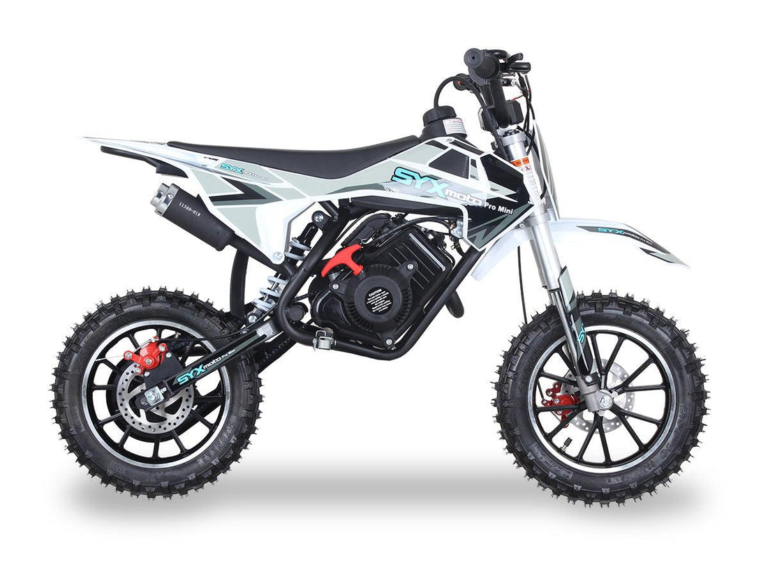 White and black SYX Moto Pro Mini gas-powered dirt bike with knobby tires for kids, shown on white background