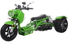 Green Maddog 150cc trike scooter with wide rear tires and dual headlights on white background