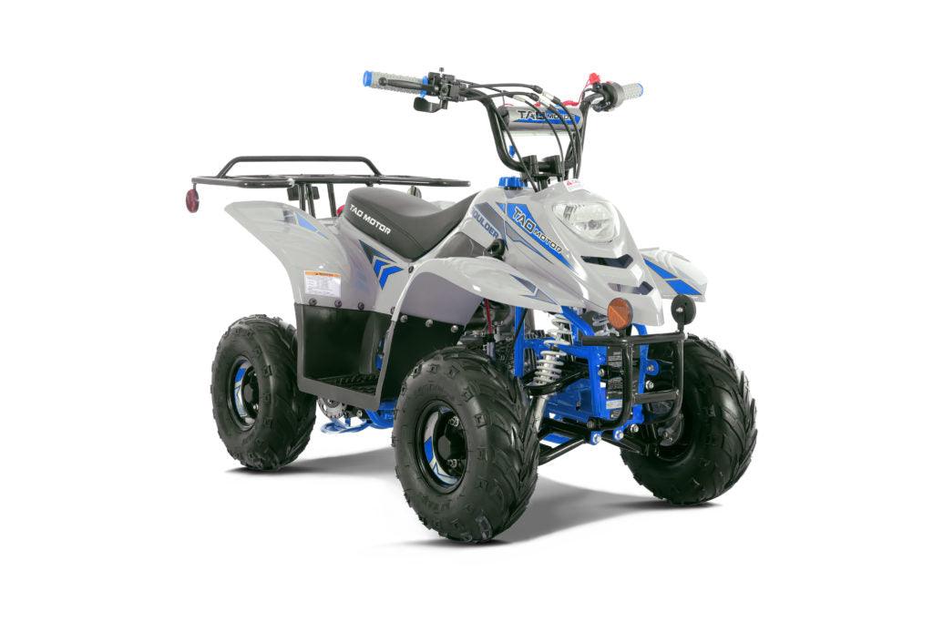 White and blue 110cc kids ATV with off-road tires and rear cargo rack on white background