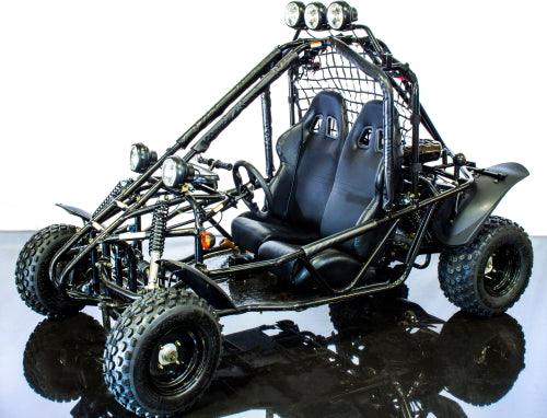 Black off-road go-kart with dual seats, rugged tires, headlights, and roll cage on reflective floor