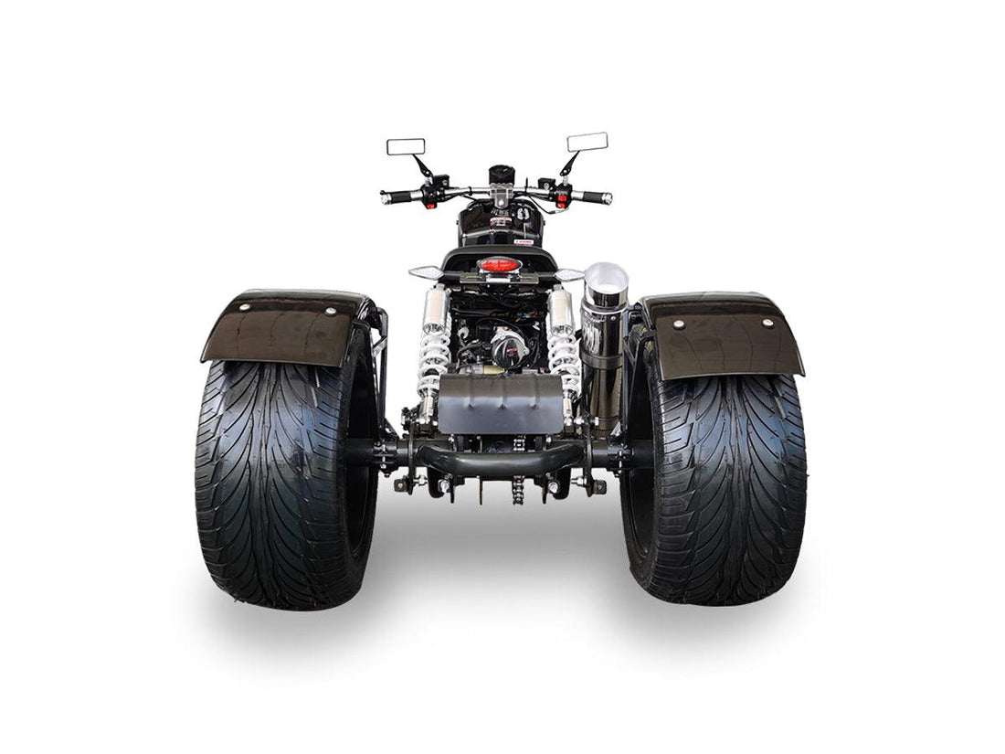 Rear view of a Maddog 50cc trike scooter with wide tires and dual shock absorbers on white background