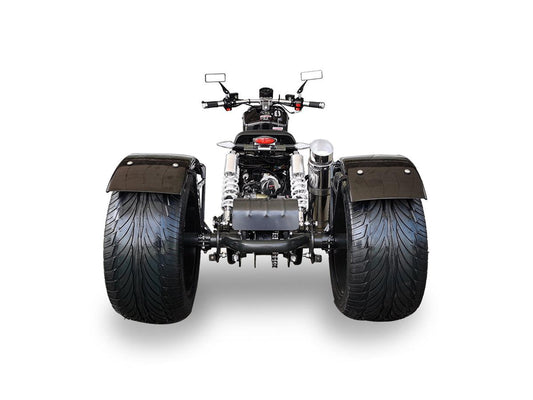 Rear view of a Maddog 50cc trike scooter with wide tires and dual shock absorbers on white background