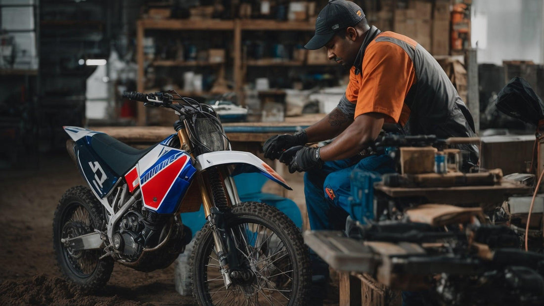 Mechanic servicing a four-stroke dirt bike in a workshop, maintenance concept