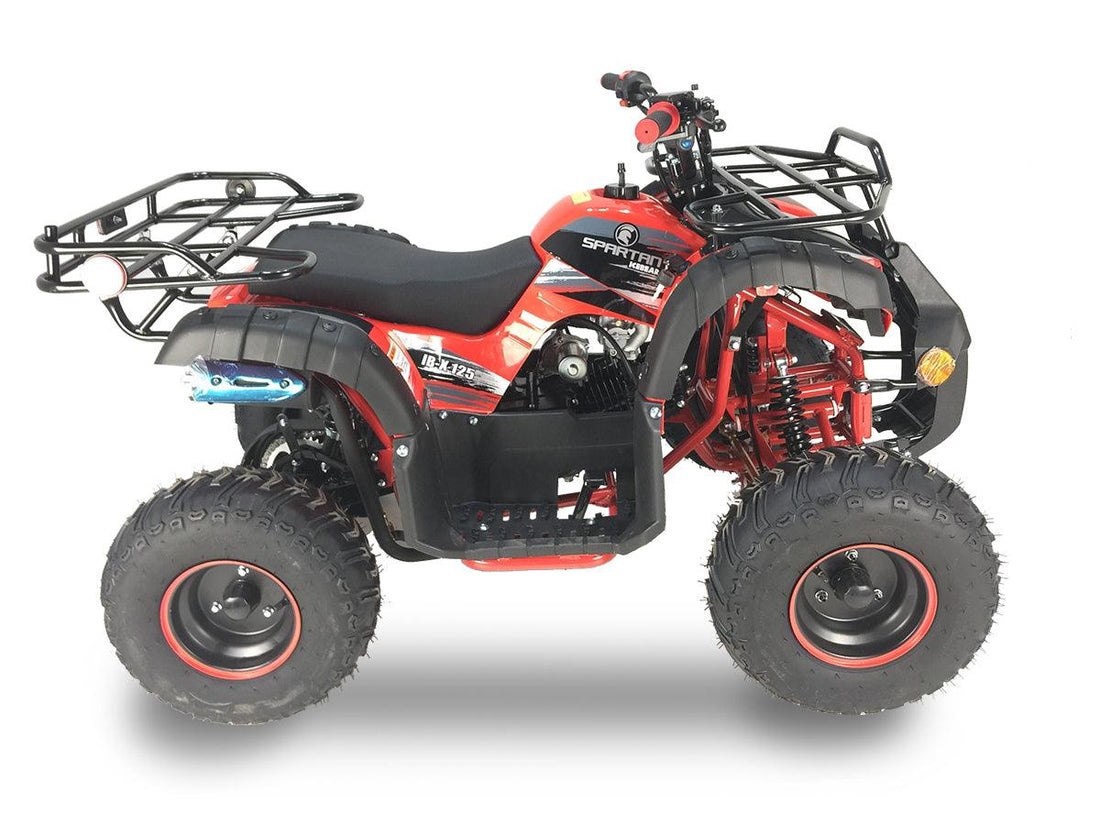 Red youth ATV with rugged tires, front and rear racks, and off-road design, side view