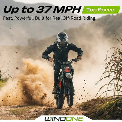 Rider on RS5 dirt bike speeding off-road, creating dust, with mountains in the background.
