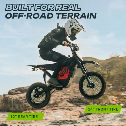 Rider on electric dirt bike with 14-inch front, 12-inch rear tires jumping over rocky terrain